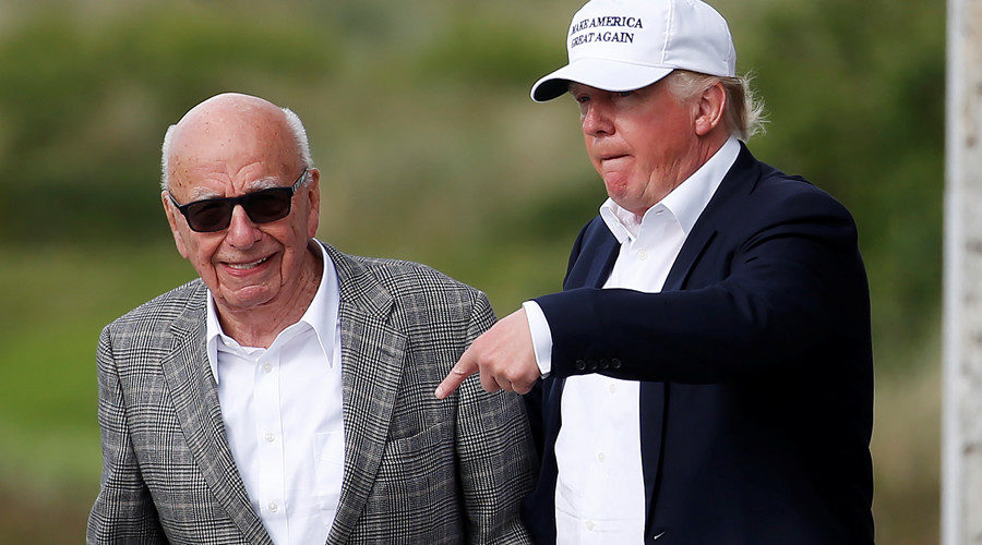 U.S. President Donald Trump (R) speaks to media mogul Rupert Murdoch