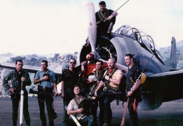 CIA pilots and crews prepare to re-arm a T-28 bomber for bombing missions on Laos 1964