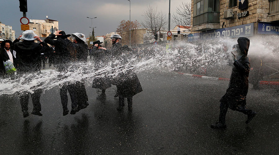 Ultra-Orthodox Jewish protestors are sprayed with water by Israeli police in Jerusalem February 9, 2017