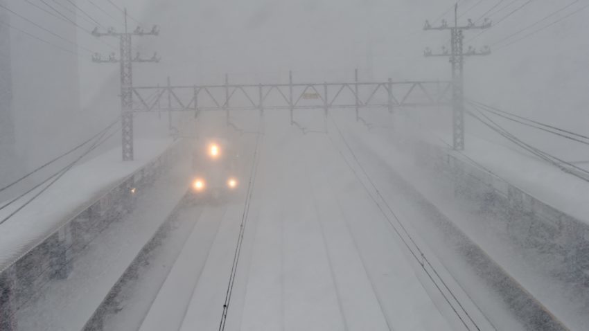 A commuter walks through the snow at the Metro North Greenwich train station in Connecticut.