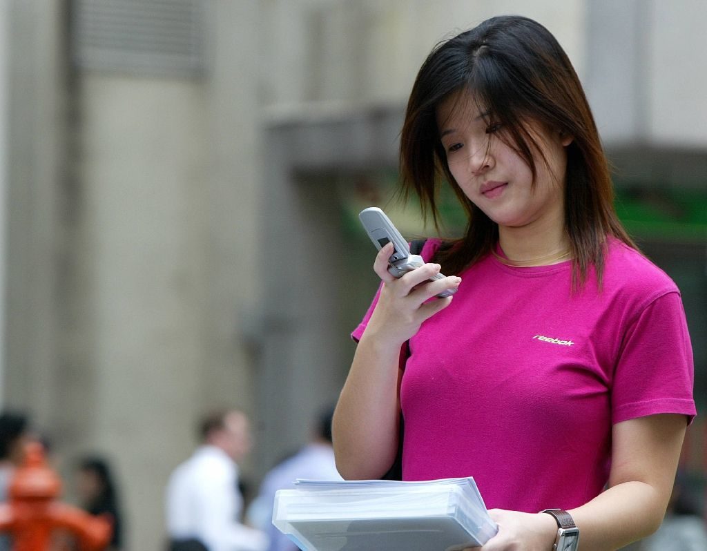 Click to enlarge woman and cell phone