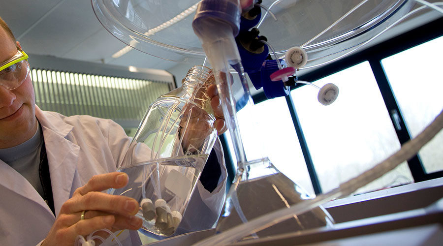Click to enlarge lab worker