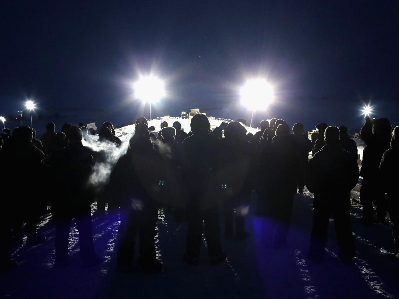Click to enlarge Military veterans, most of whom are native American, confront police guarding a bridge near Oceti Sakowin Camp on the edge of the Standing Rock Sioux Reservation on November 30, 2016 outside Cannon Ball, North Dakota