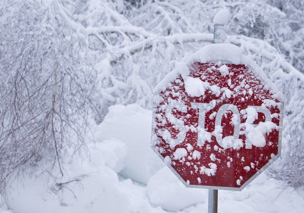 Wet snow coats a stop sign in Kennebunk Thursday morning. Stop is what many Mainers may be thinking as they wake up to yet another day of digging themselves out.