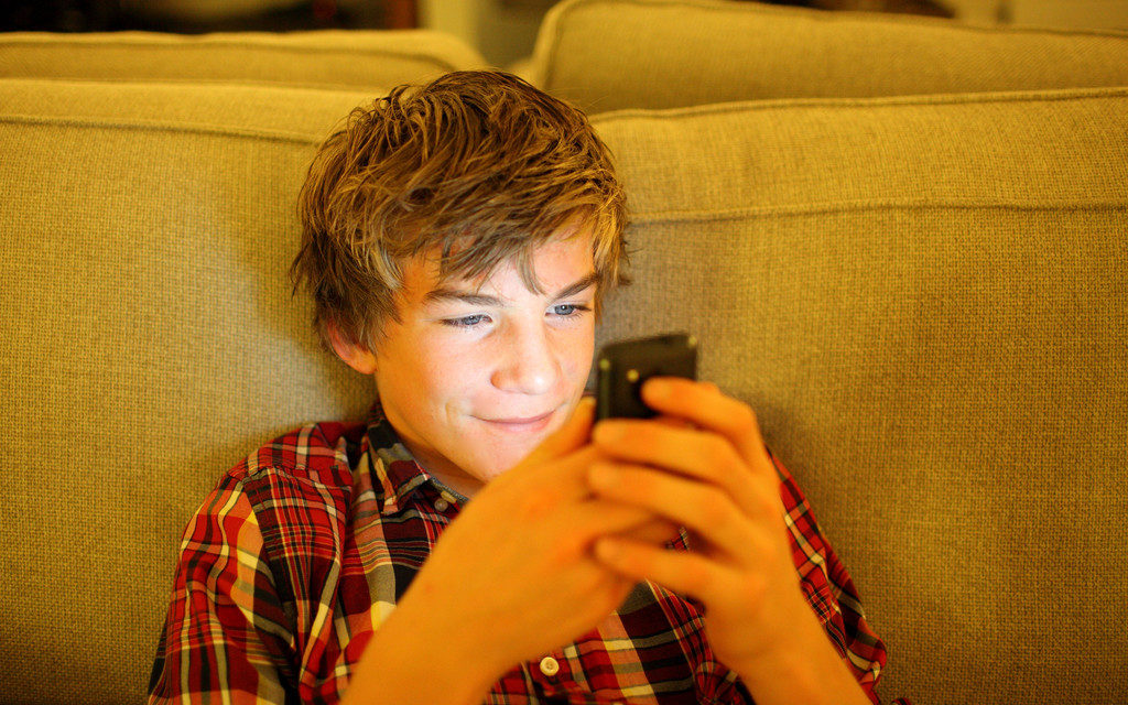 Click to enlarge kid on phone