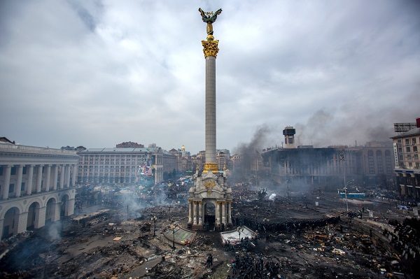 Fire, smoke and protesters on Maidan square in Kiev. February 22, 201