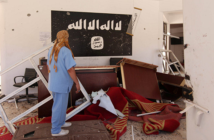 Click to enlarge Libyan man checks a building