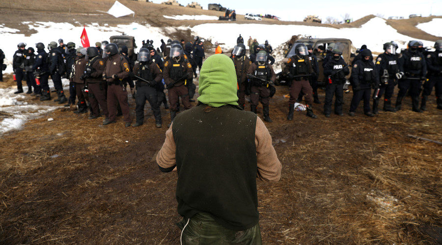 Police form a line to push back protesters, North Dakota, U.S., February 23, 2017