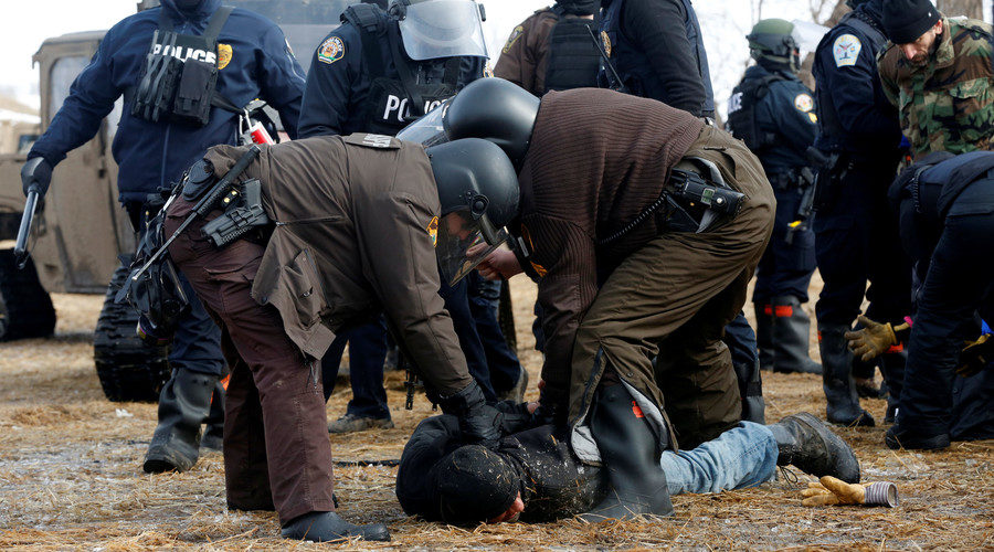 Click to enlarge Police detain a protester against the Dakota Access oil pipeline, North Dakota, U.S., February 23, 2017