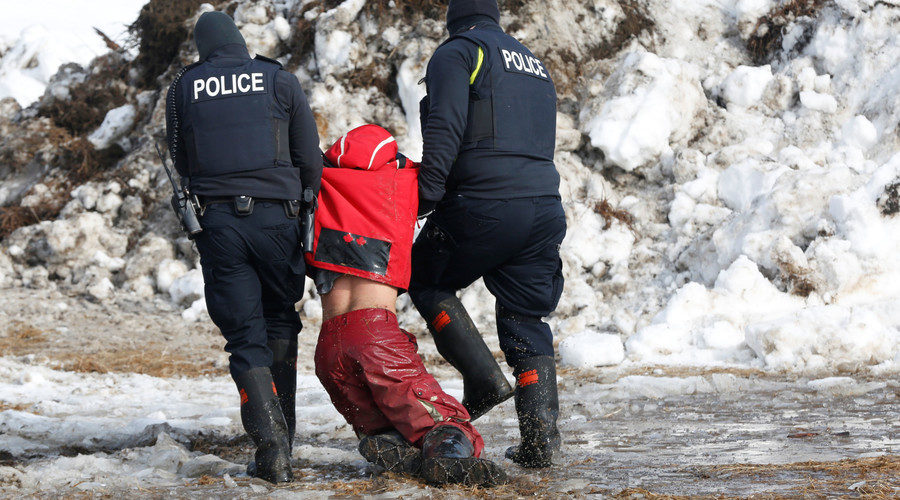 Click to enlarge Police detain a protester against the Dakota Access oil pipeline, North Dakota, U.S., February 23, 2017