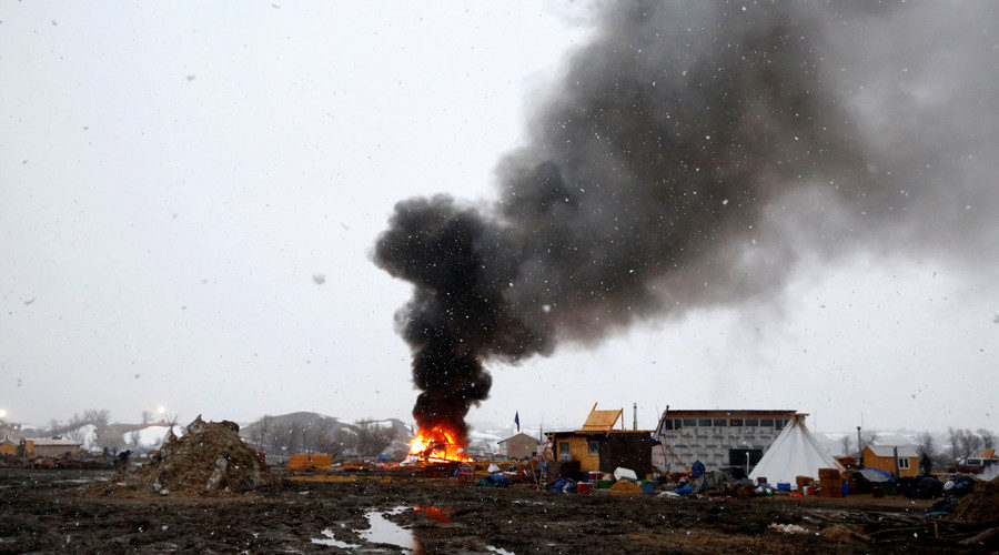 Click to enlarge A building burns after it was set alight by protesters, North Dakota, U.S., February 22, 2017