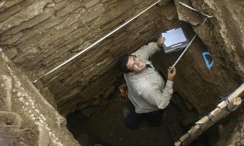 Click to enlarge Graduate student Mario Borrero excavates the substructure of the palace building