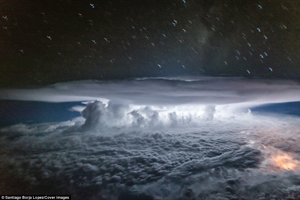 Pilot and photographer, Santiago Borja, had to get the timing of his photography just right and capture the storm when it was illuminated by a flash of lighting.