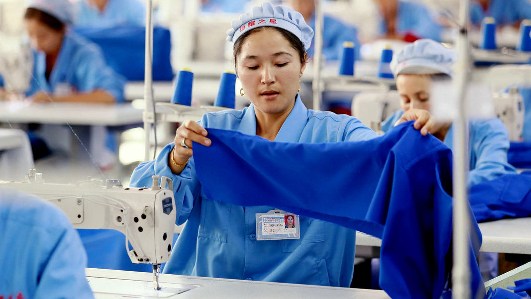 Click to enlarge Chinese clothing factory worker