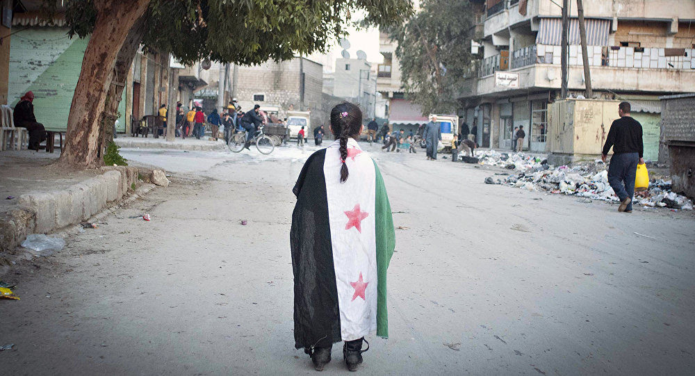 Syrian girl draped in flag