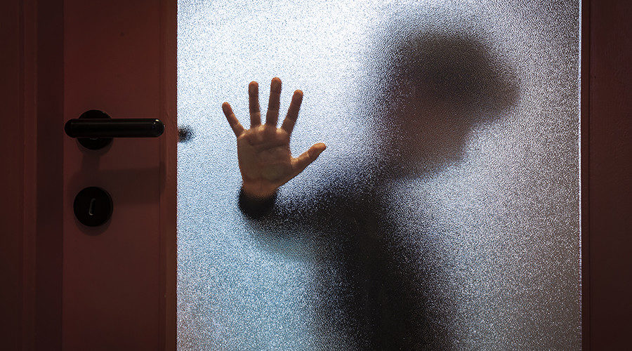Child behind door