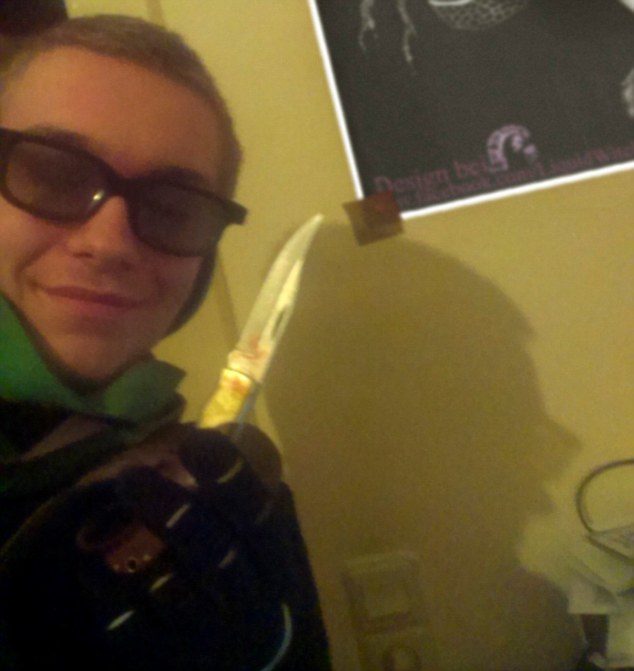 Click to enlarge Marcel Hesse posed for a picture with a bloodied knife