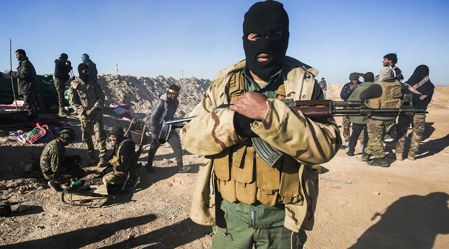 A masked fighter of the Hashed al-Shaabi (Popular Mobilisation) paramilitaries
