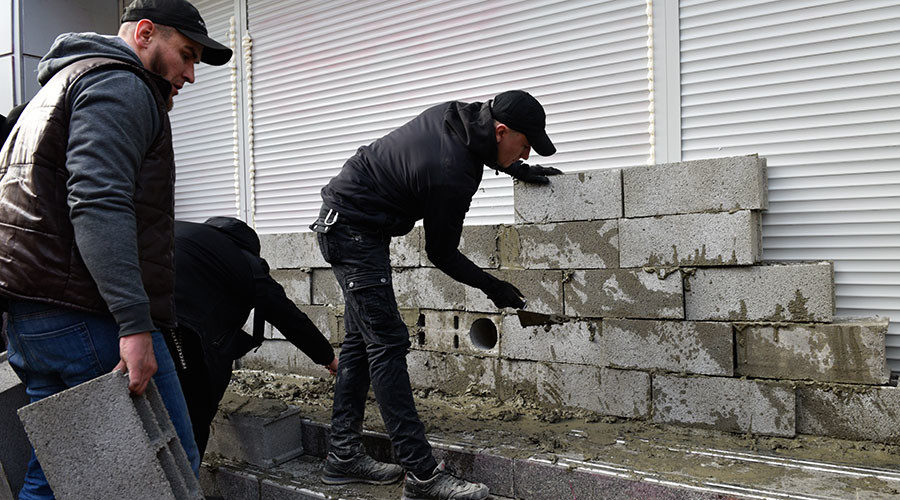 Russian bank Ukraine radicals Azov battalion brick