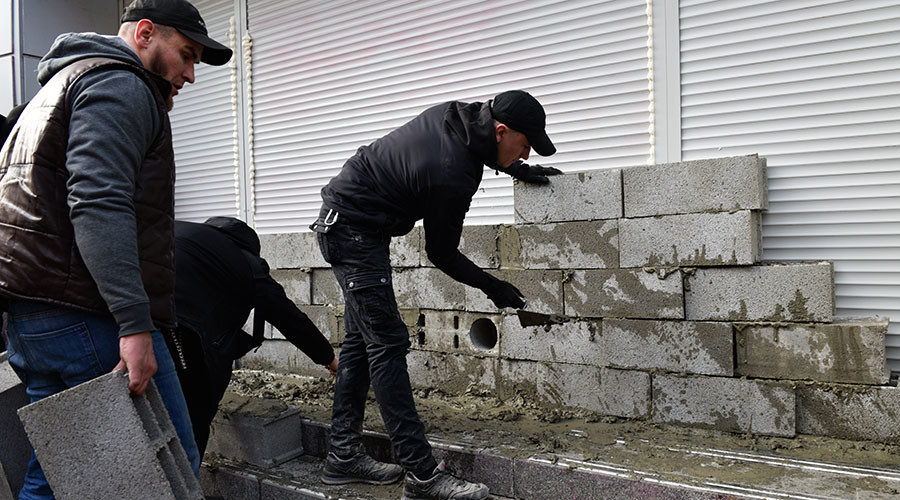 Click to enlarge Russian bank Ukraine radicals Azov battalion brick
