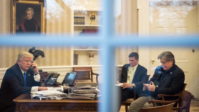 President Donald Trump in the Oval Office on January 28th, 2017 with Michael Flynn and Steve Bannon