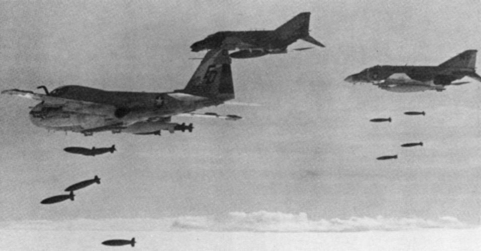 U.S. fighter jets and an attack plane drop bombs on Cambodia circa 1973
