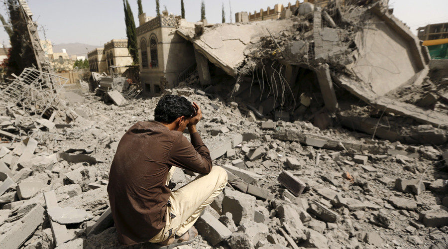 Grieving man in Yemen destruction