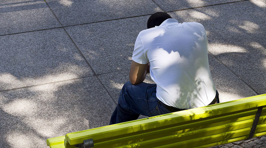 Sad Millennial sitting on bench