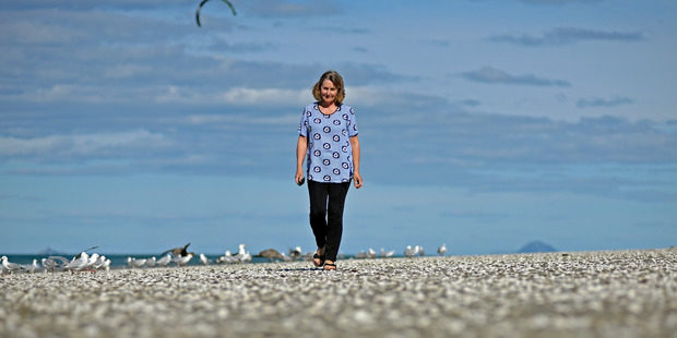 Thousands of dead shellfish washed ashore at Waihi Beach have shocked local residents, including Jeannette McCallum. 