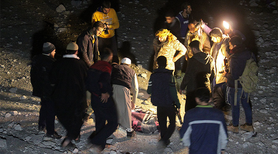 Syrian civil defence volunteers dig through the rubble of a mosque in the village of Al-Jineh in Aleppo province March 16, 2017.