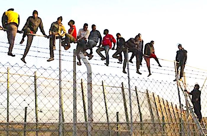 Click to enlarge men on fence