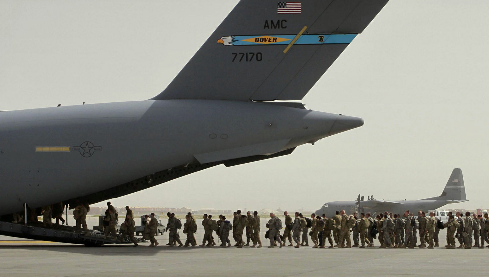 U.S. soldiers board a U.S. military aircraft in Bagram, north of Kabul, Afghanistan. 