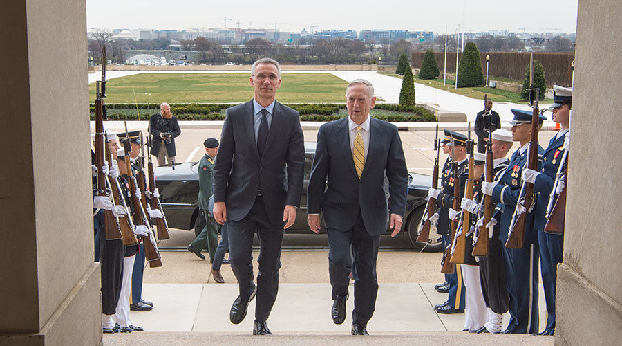 Defense Secretary Jim Mattis walk with NATO Secretary General Jens Stoltenberg