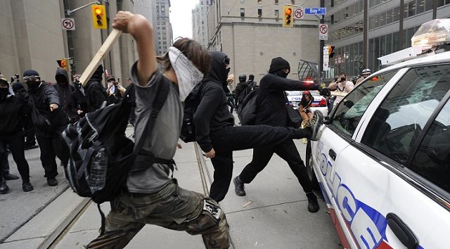 Click to enlarge leftist protesters