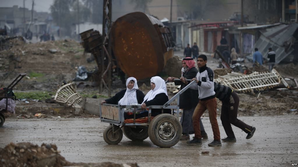 Civilians flee the city of Mosul
