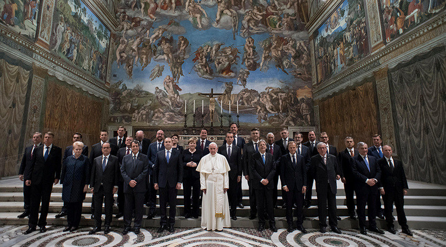 Pope Francis poses in the Sistine chapel during a meeting with EU leaders 