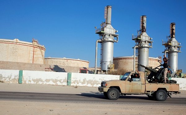 Libyan forces loyal to eastern commander Khalifa Haftar ride a pickup truck at the Zueitina oil terminal in Zueitina, west of Benghazi, Libya