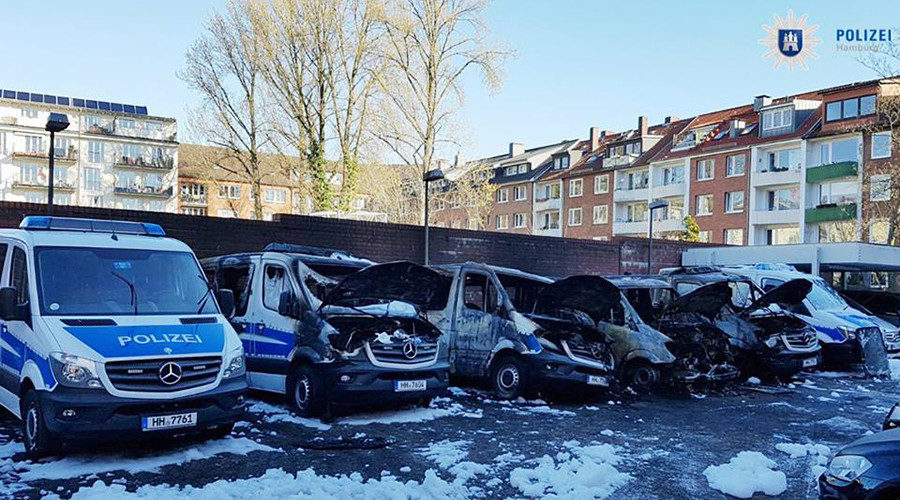 burnt police cars Germany