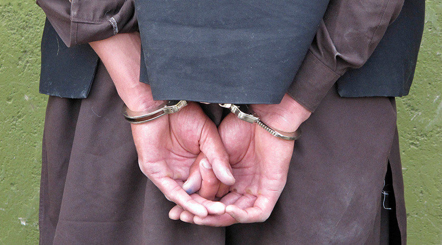 refugee arrested handcuffs migrant immigration
