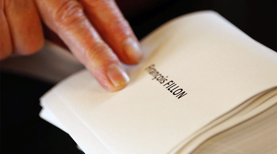 Ballots with the name of Francois Fillon at a polling station