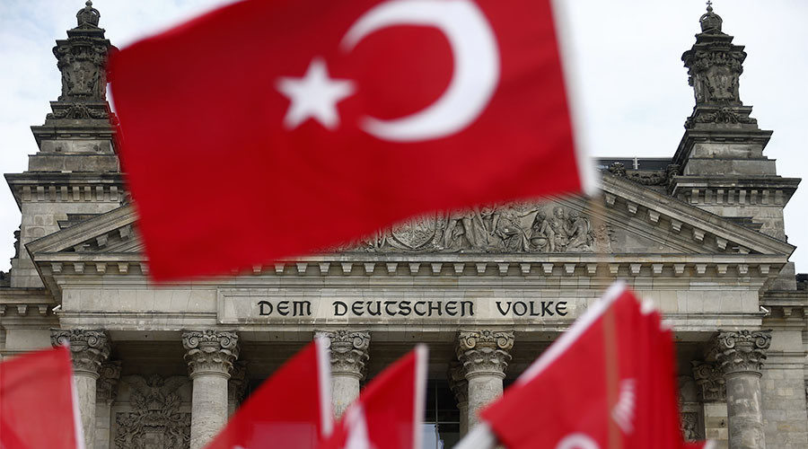 Click to enlarge Demonstrators wave Turkish flags in front of the Reichstag