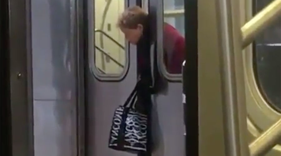 woman stuck on nYC train