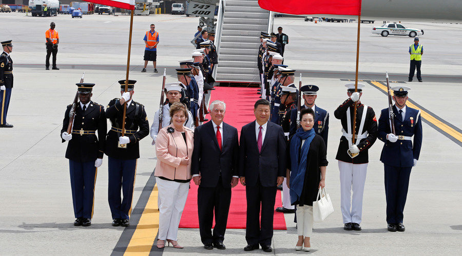 China's President Xi Jinping and his wife Peng Liyuan are greeted by U.S. Secretary of State Rex Tillerson and his wife Renda St. Clair