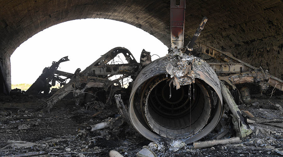 The body of a plane burned as a result of the US missile attack on an air base in Syria