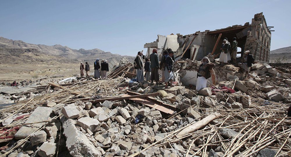 People inspect a house destroyed by a Saudi-led airstrike in the outskirts of Sanaa, Yemen, Thursday, Feb. 16, 2017