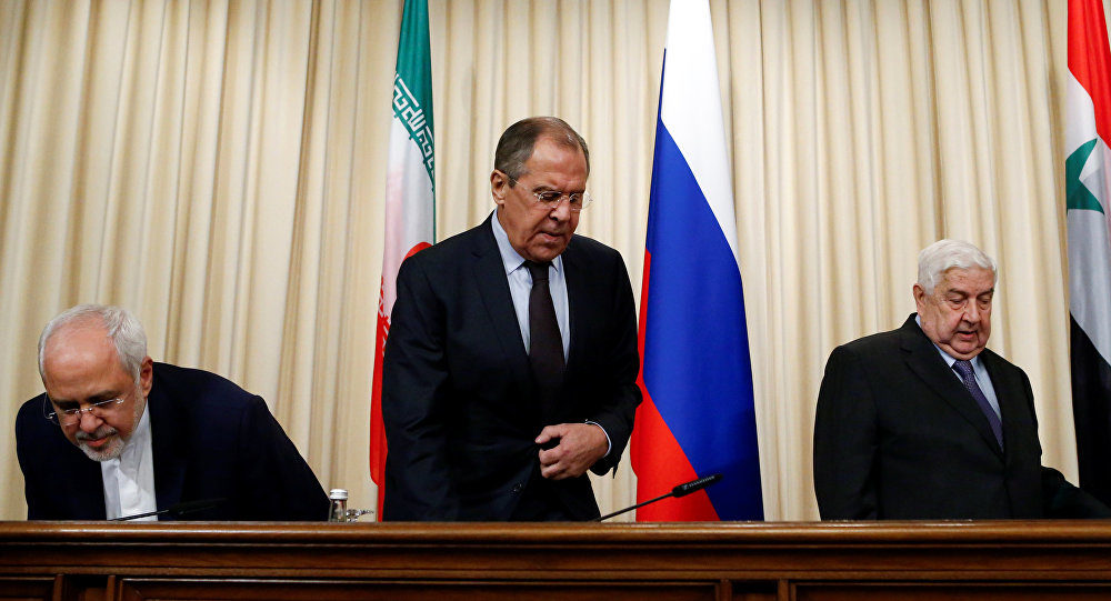 Russian Foreign Minister Sergei Lavrov (C), Syrian Foreign Minister Walid al-Muallem (R) and Iranian Foreign Minister Javad Zarif