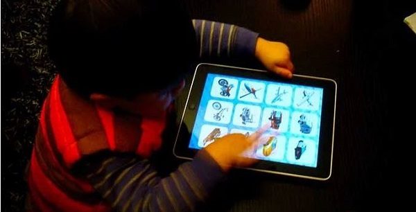 toddler with iPad