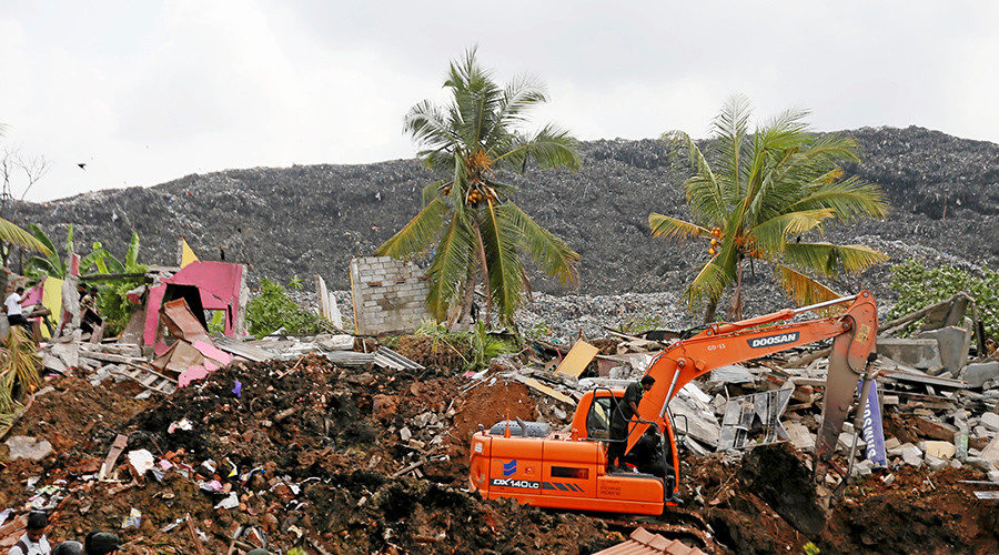 A damaged house is seen during a rescue mission after a garbage dump collapsed and buried dozens of houses in Colombo, Sri Lanka