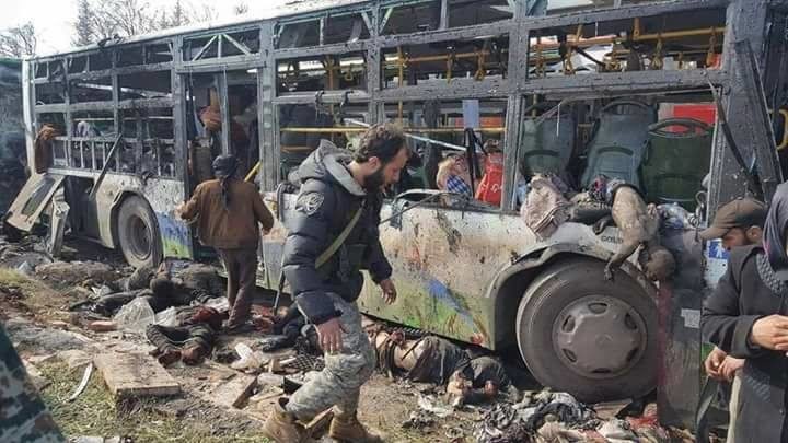 Click to enlarge Still image shows bodies lying near burnt out buses in what is said to be Aleppo's outskirts