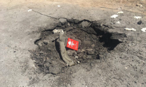 Another photo of the crater containing the alleged canister that supposedly disbursed sarin in Khan Sheikdoun